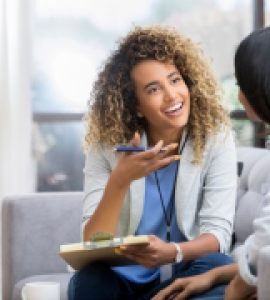 Counselor talks to a young woman