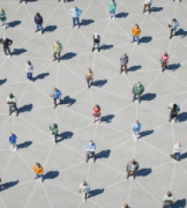 Crowd of people socially distanced with chalk lines connecting them