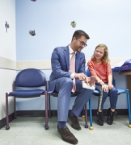 Doctor talking with child