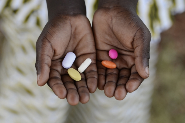 Hands holding pills