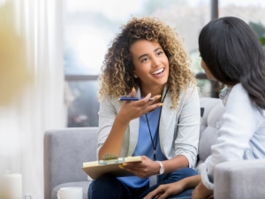 Counselor talks to a young woman