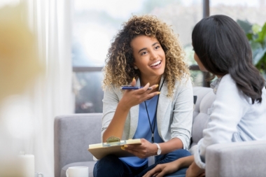 Counselor talks to a young woman