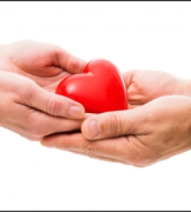 Person giving a heart figure to another person