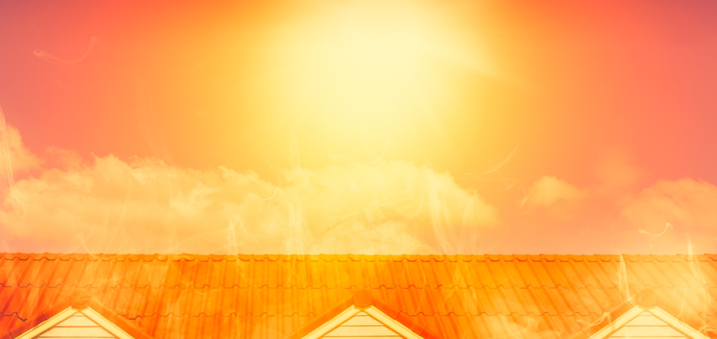 Orange sun over rooftop