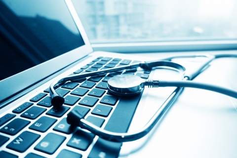 Stethoscope sitting on laptop keyboard	