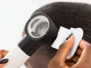 Dermatologist checking a patient's hair